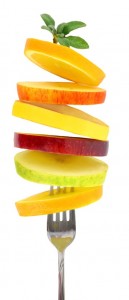 Fresh slices of fruits on a fork